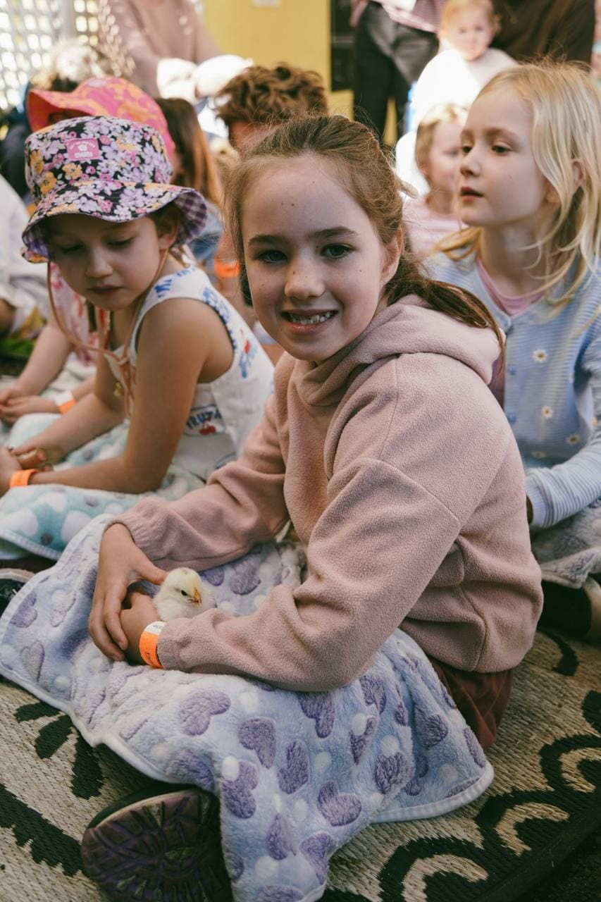 Smiles all round with a fluffy chick at the Cheeky Chicks Showtime