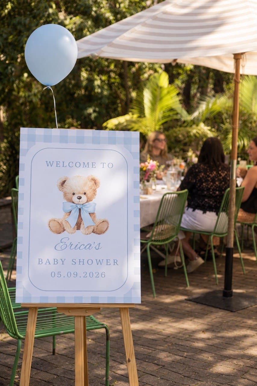 Welcome sign on an easel with a blue balloon at a baby shower on the terrace at Fairhill, Ninderry