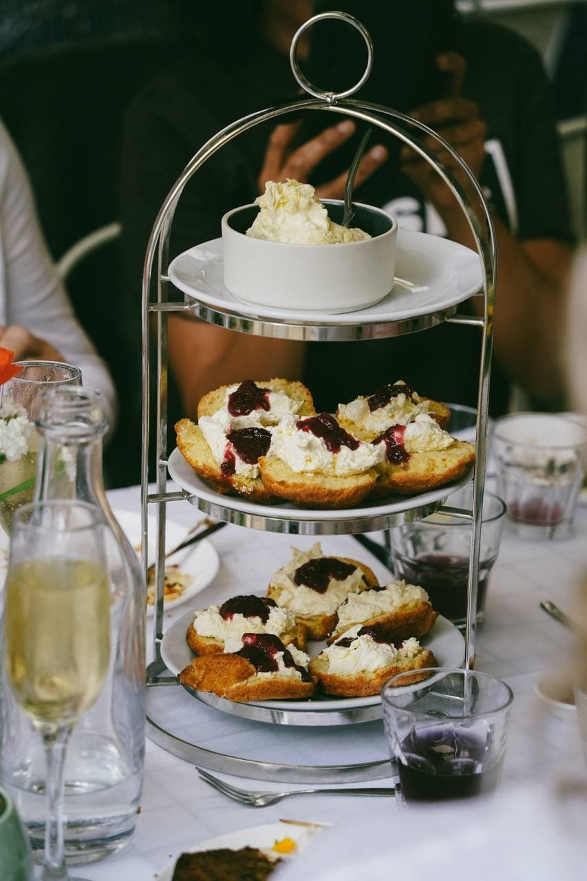 Tiered stand of scones with jam and cream at a Fairhill morning tea