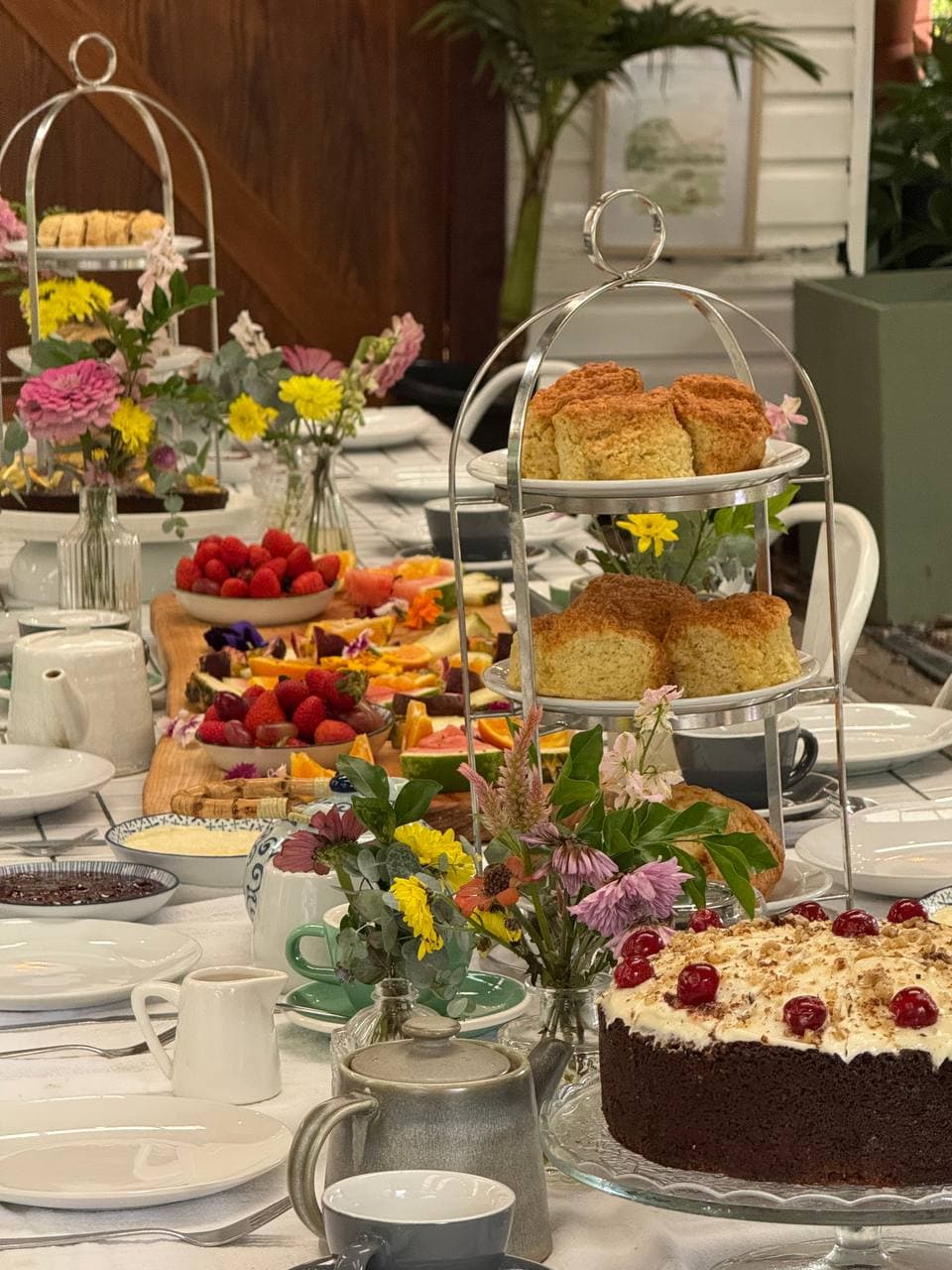 Tiered cakes, scones and fresh florals at Fairhill