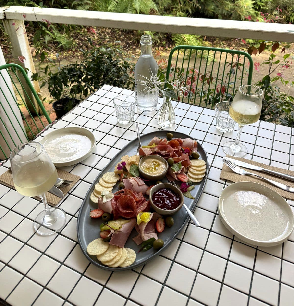 A grazing platter and wine for two on the terrace overlooking the Fairhill gardens