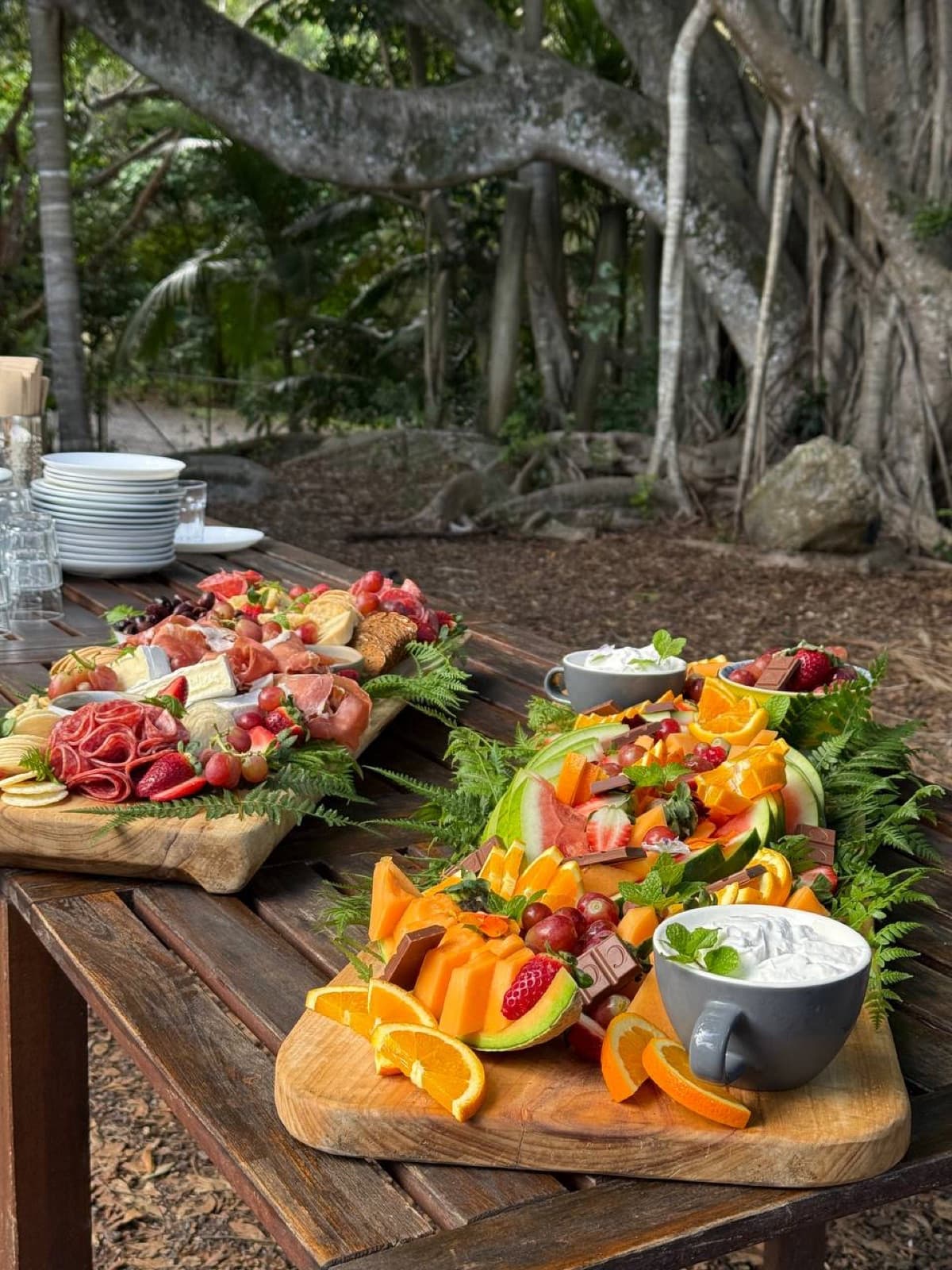 Grazing tables set under the fig trees for a celebration at Fairhill on the Sunshine Coast
